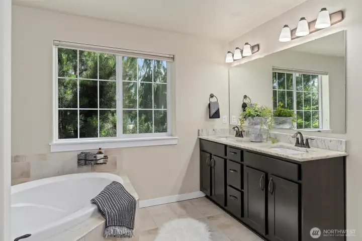 A spa-like 5-piece primary ensuite bath.