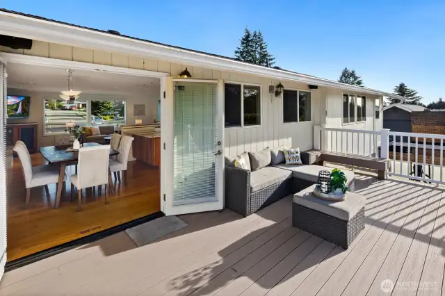 Doors off kitchen and dining space onto deck