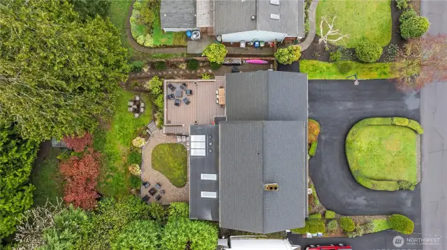 Freshly landscaped, private backyard with tiered deck, new roof/gutters and more!