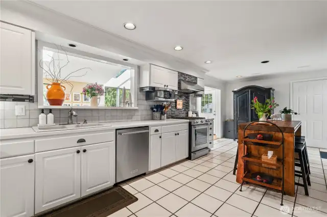 Kitchen with island space and an additional wet bar to the right!
