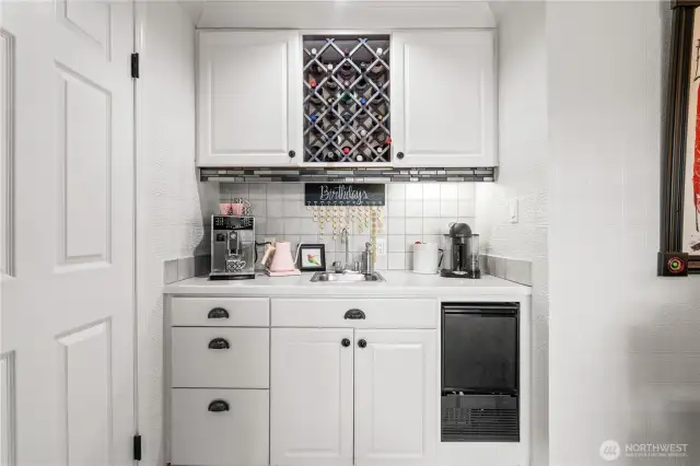 Additional wet bar with second sink, wine storage & mini fridge!