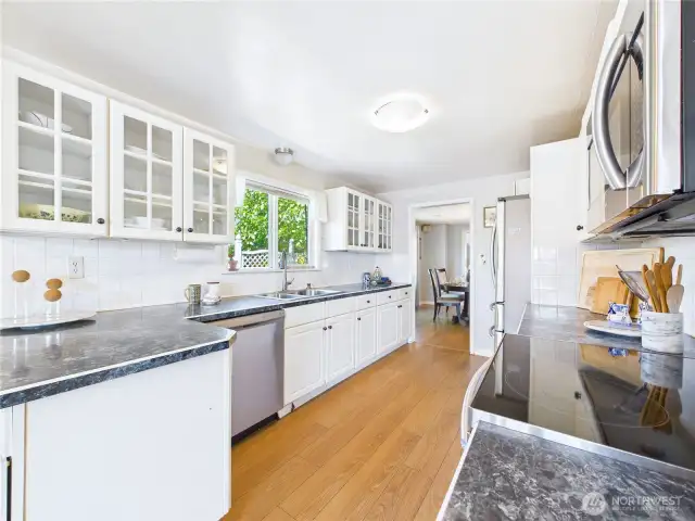 The cabinets with glass inlays make finding what you are looking for easy. It also gives you opportunities to display your pretty dishes.