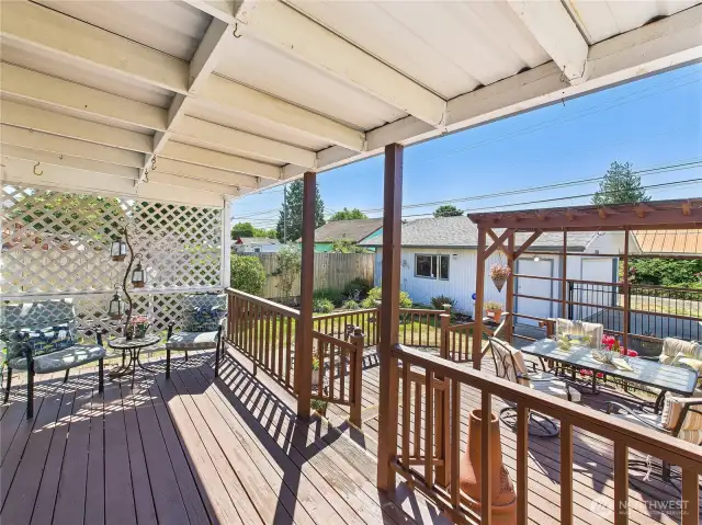 This back yard is the perfect NW back yard. Covered area for those days when the sun is blazing down or when it rains. Uncovered deck for when you want to work on your tan or eat outside al fresco.