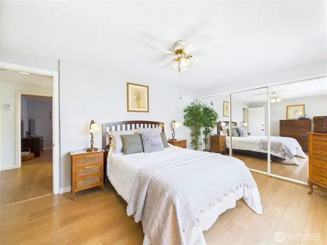 The primary bedroom has a view of the back yard.