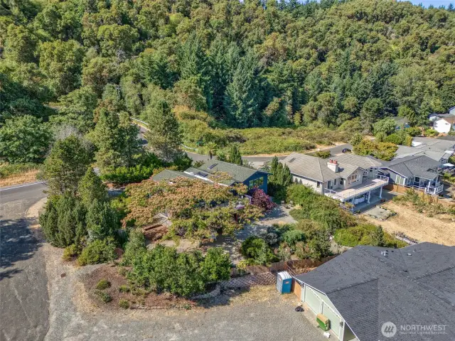 House sheltered by private gardens and backing up to Marine Park.
