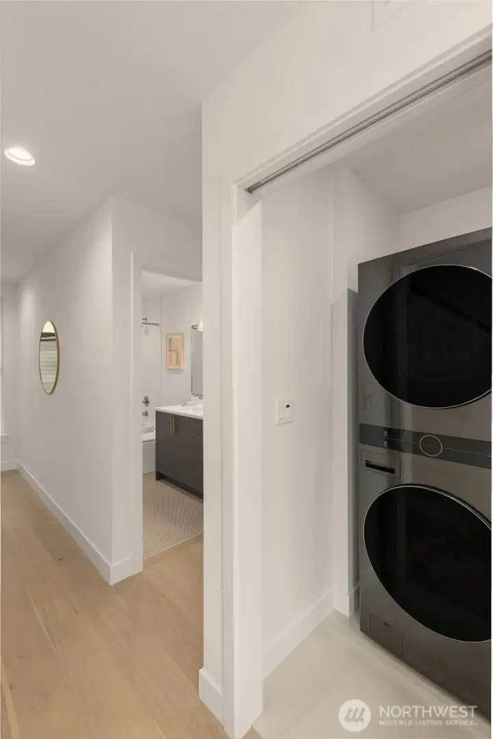 Tucked smartly upstairs, this full laundry setup keeps things clean and convenient.