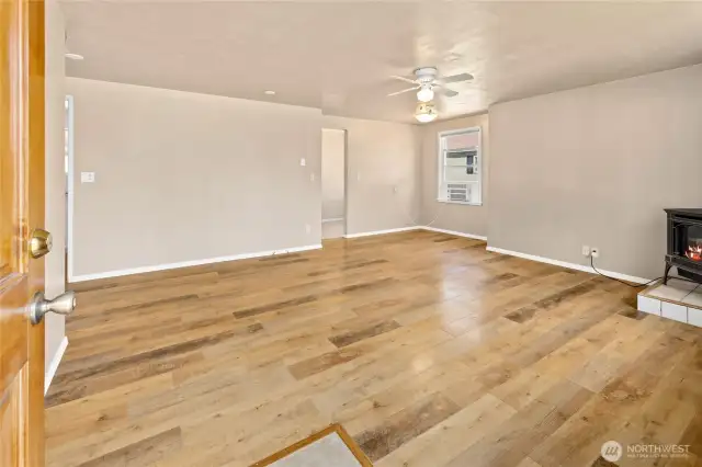 Living room with laminate flooring.