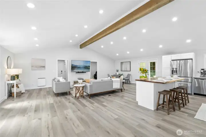 Spacious and light-filled open-concept great room, all-new contemporary bathrooms, updated flooring, windows, millwork, fresh interior & exterior paint, and updated heating & cooling systems for year-round comfort.