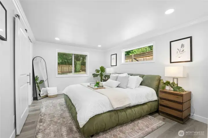 The spacious primary suite includes a luxurious ensuite bathroom & walk-in closet.