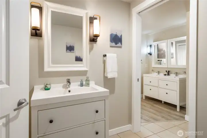 Handy half bath off of the hallways for guests.