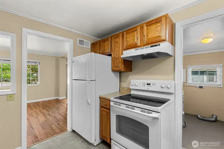 Kitchen into dining or Laundry/Mudroom