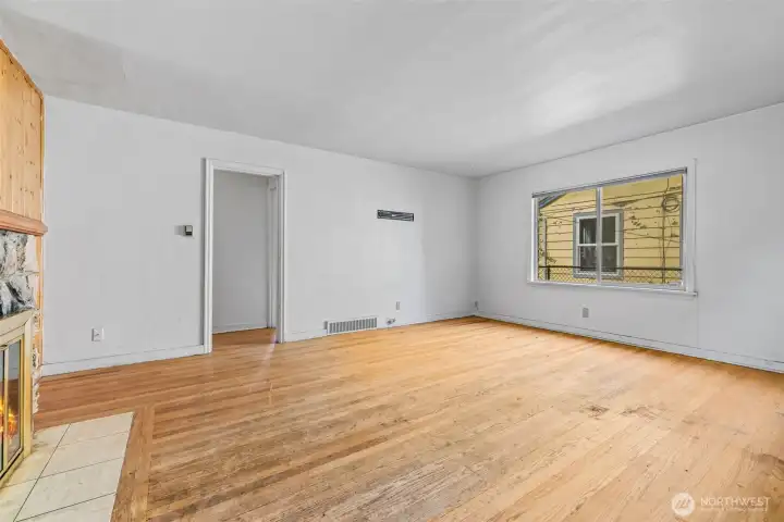 Living room area on main floor with wood floors and natural light.