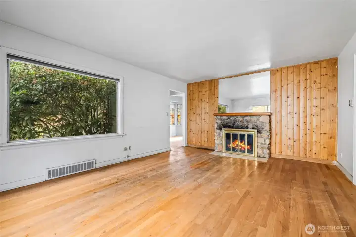 Living room with fireplace—great layout for future redesign.
