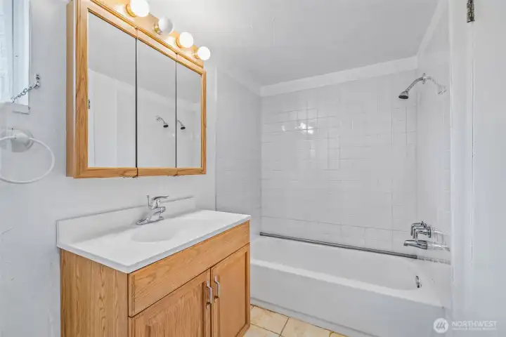 Downstairs bathroom—functional layout, ready for updates.
