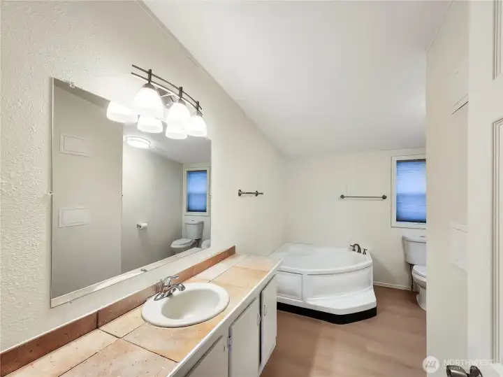 Luxurious 5-piece bath with a relaxing soaking tub.