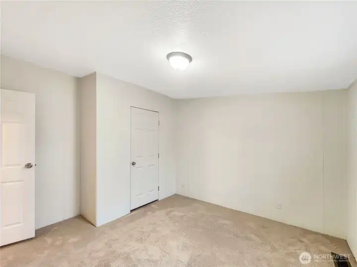 The secondary bedrooms feature ample closet space and plenty of natural light, providing both comfort and practicality. The luxury carpet will keep your feet warm.