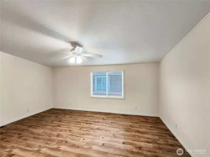 A huge primary suite with ample room for both rest and productivity—perfect for an office corner, fitness space, or private retreat.