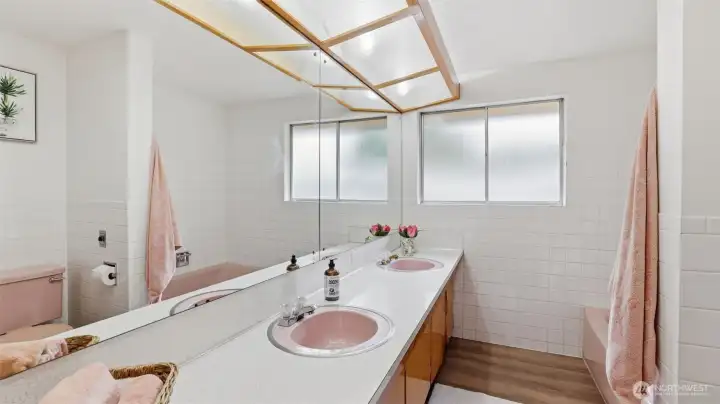 A classic upper-level full bath with plenty of counter space and charming original touches.