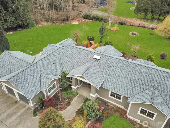 Impressive roofline and single-level design on a nearly 4-acre property.