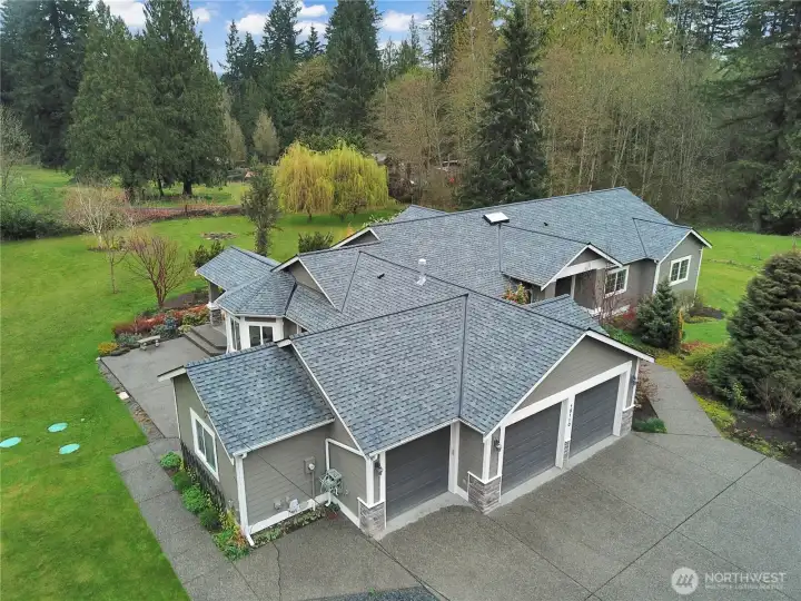 Impressive roofline and single-level design on a nearly 4-acre property.