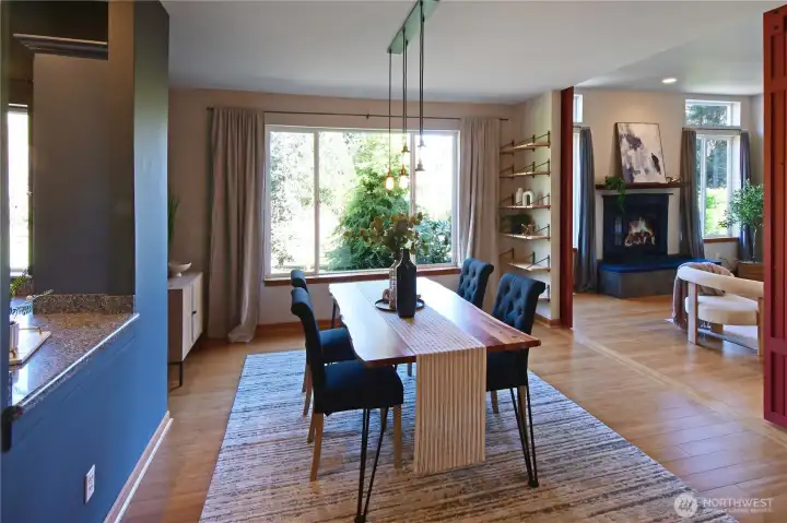 Open dining and living area just off the kitchen, highlighting the home’s single-level design and easy flow.