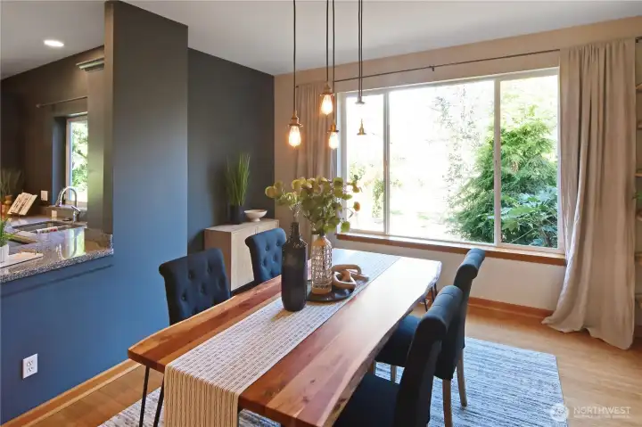Stylish dining area with designer lighting and seamless connection to the kitchen for easy entertaining.