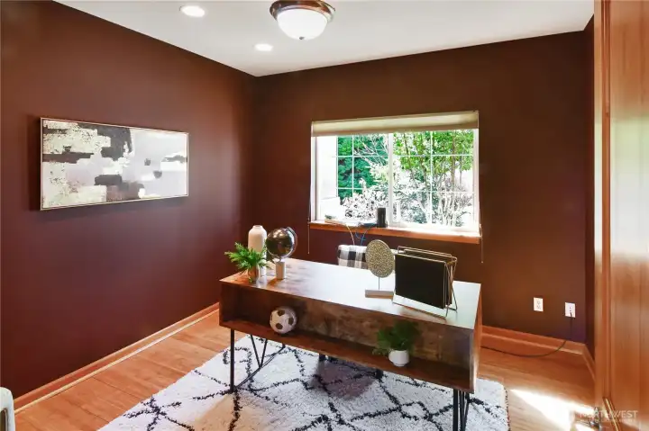 Versatile main-level office or bedroom with natural light and comfortable, single-level accessibility.