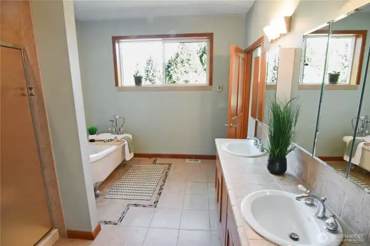 Inviting primary bath featuring heated floors, thoughtful design, and comfortable single-level accessibility.