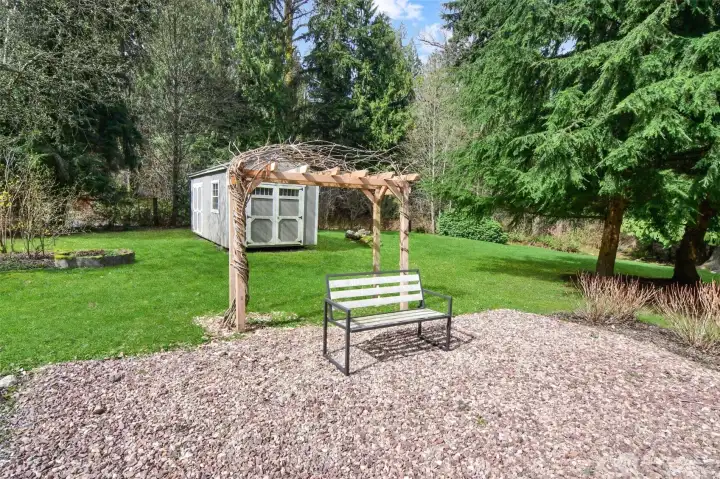 A garden shed for tools and mower.