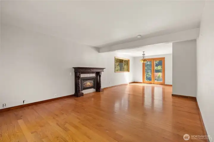 livingroom into large family room with double doors onto back deck