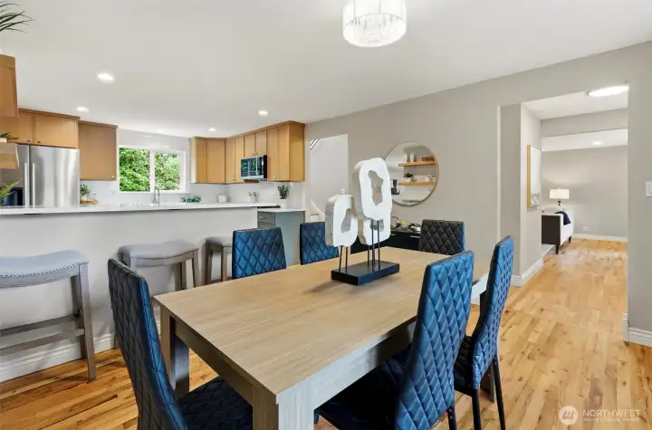 Informal/formal dining area open to the kitchen with breakfast bar.