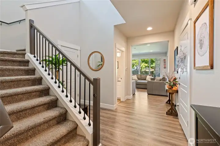 As you enter deeper into the home, the stairs leading to the 2nd and 3rd level are to the left.