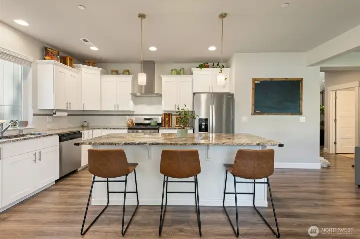 View from the vantage point of the kitchen with the dinner table directly behind you.