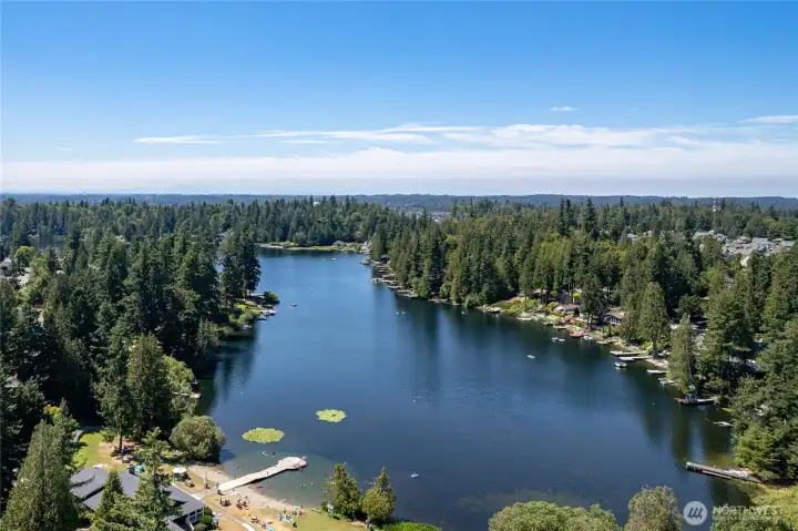 View of the community amenities - HOA clubhouse and dock. The park & playground are a little underneath the shot.