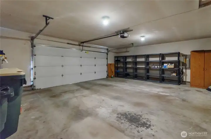 Large 2 car garage with extra storage shelves