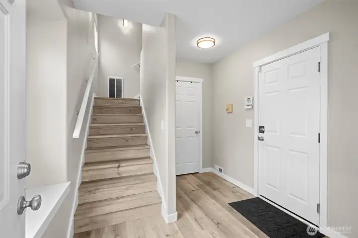 Newer LVP flooring greets you at the entry. Add a bench or your shoe rack for an easy drop zone.
