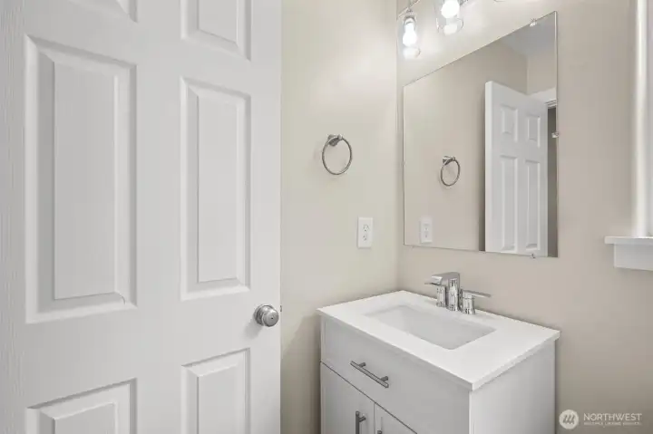 The 1/2 bath complements the main floor.