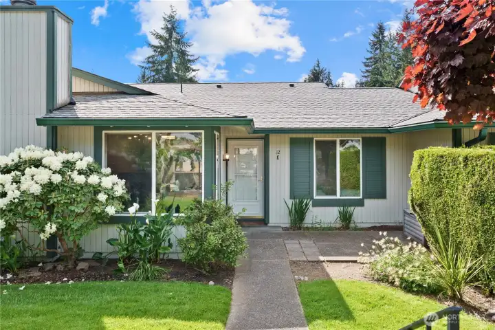 Mature, well maintained landscaping greets you from the moment you arrive.
