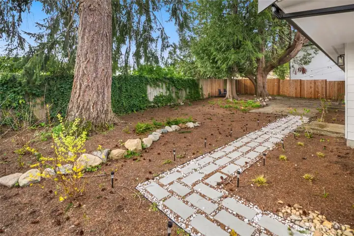 Beautiful, private rear yard space with multiple entertaining spaces.