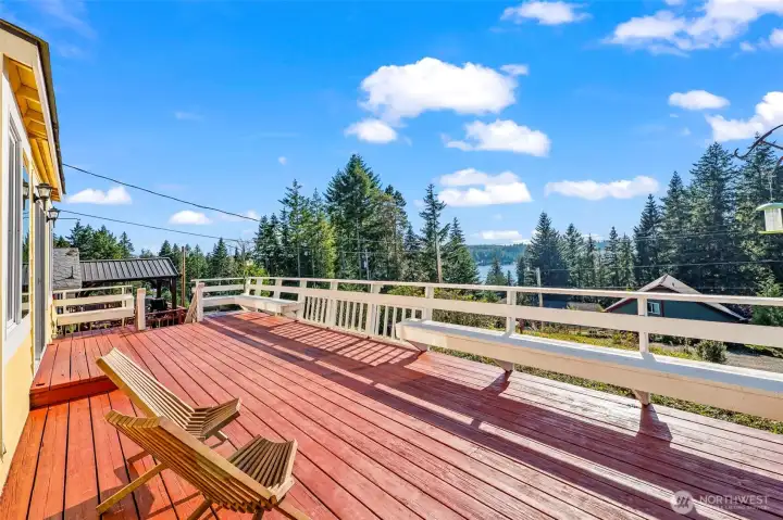Expansive entertaining deck with peaceful lake views—perfect for summer evenings, outdoor dining & relaxing after a day on Mason Lake. Expansive entertaining deck with peaceful lake views—perfect for summer evenings, outdoor dining & relaxing after a day on Mason Lake.