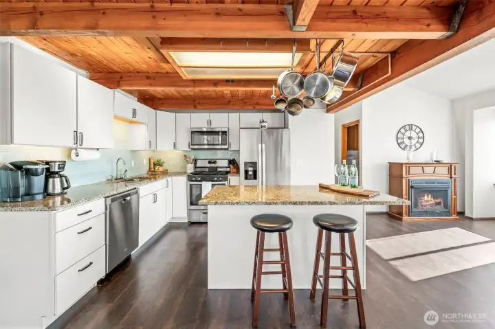 Spacious kitchen designed for gathering with quartz countertops, abundant prep space & seamless flow into the open-concept living areas. Spacious kitchen designed for gathering with quartz countertops, abundant prep space & seamless flow into the open-concept living areas.