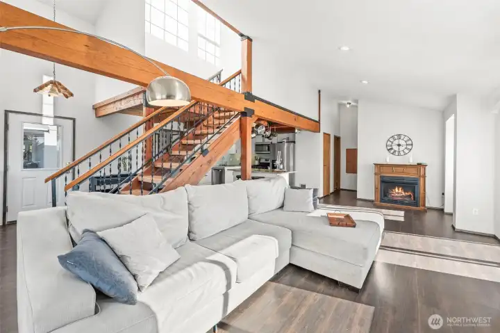 Open-concept design seamlessly connects the living room, kitchen & upper level, creating an airy gathering space ideal for entertaining and everyday lake living. Open-concept design seamlessly connects the living room, kitchen & upper level, creating an airy gathering space ideal for entertaining and everyday lake living.