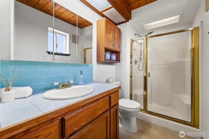 Main-floor bathroom conveniently located near the bedrooms with nearby laundry access for easy everyday living and weekend getaway convenience. Main-floor bathroom conveniently located near the bedrooms with nearby laundry access for easy everyday living and weekend getaway convenience.