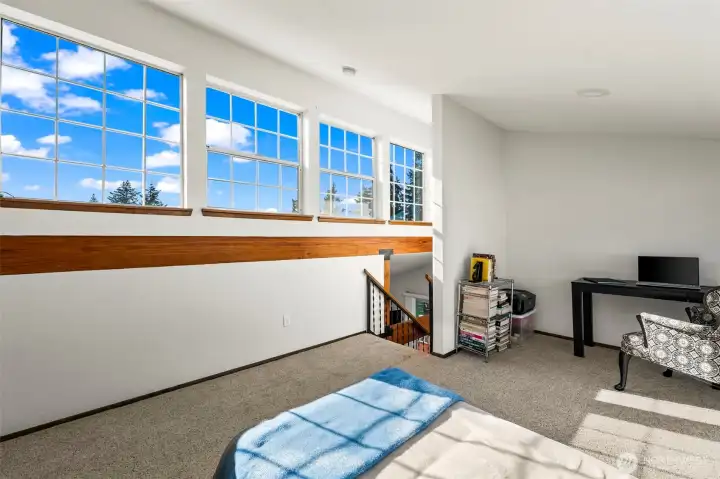 Light-filled loft retreat with expansive windows, soaring ceilings & flexible space perfect for guests, a home office or peaceful lake escape living. Light-filled loft retreat with expansive windows, soaring ceilings & flexible space perfect for guests, a home office or peaceful lake escape living.