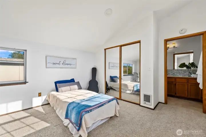Comfortable and inviting bedroom retreat with generous closet space, natural light & a peaceful atmosphere designed for relaxing after days on Mason Lake Comfortable and inviting bedroom retreat with generous closet space, natural light & a peaceful atmosphere designed for relaxing after days on Mason Lake