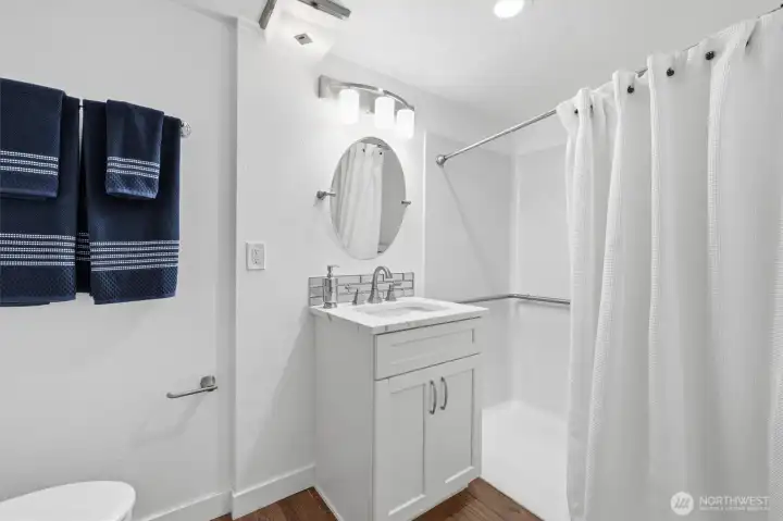 Main floor bathroom with accessible shower
