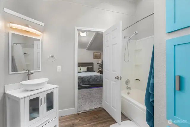 Primary bath with skylight above shower