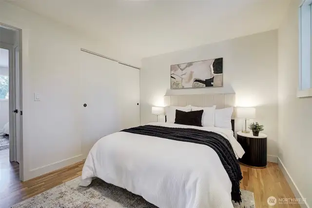 The primary bedroom looks out to the private backyard.