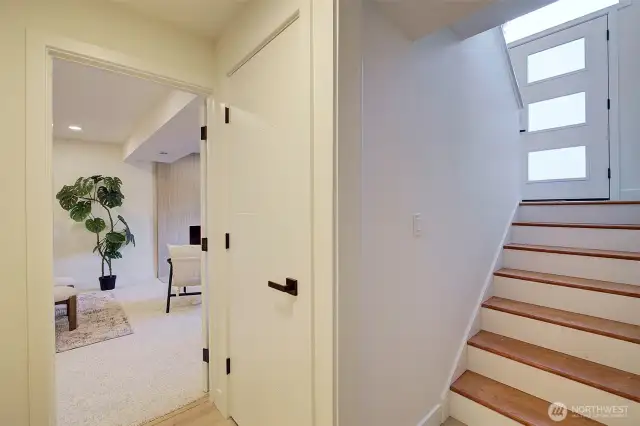 Entrance to the downstairs suite. The bathroom is to the left and garage entrance to the right.