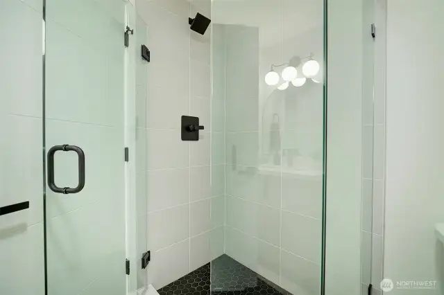 Full size shower in the downstairs bathroom.